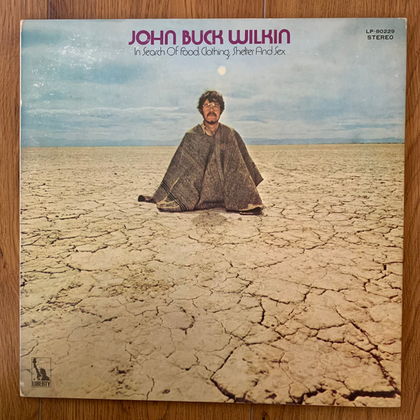 John Buck Wilkin - In Search Of Food Clothing Shelter And Sex (LP, Album)